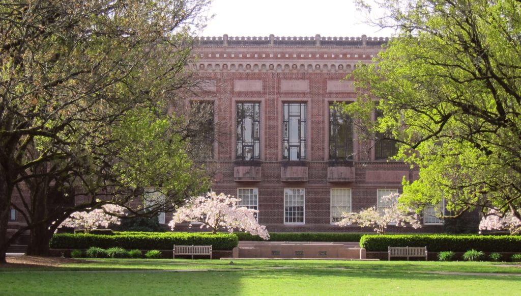 Knight Library with blooming cherry trees